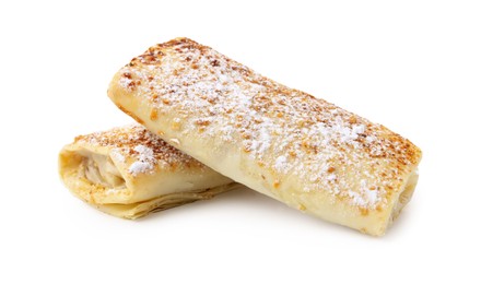 Photo of Tasty apple strudels with powdered sugar isolated on white