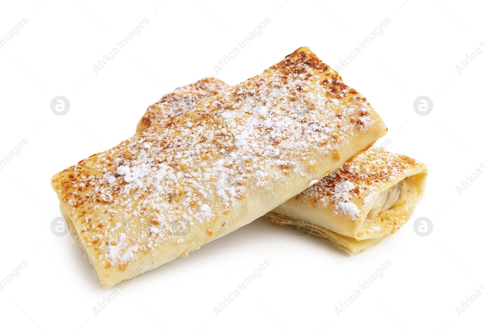 Photo of Tasty apple strudels with powdered sugar isolated on white