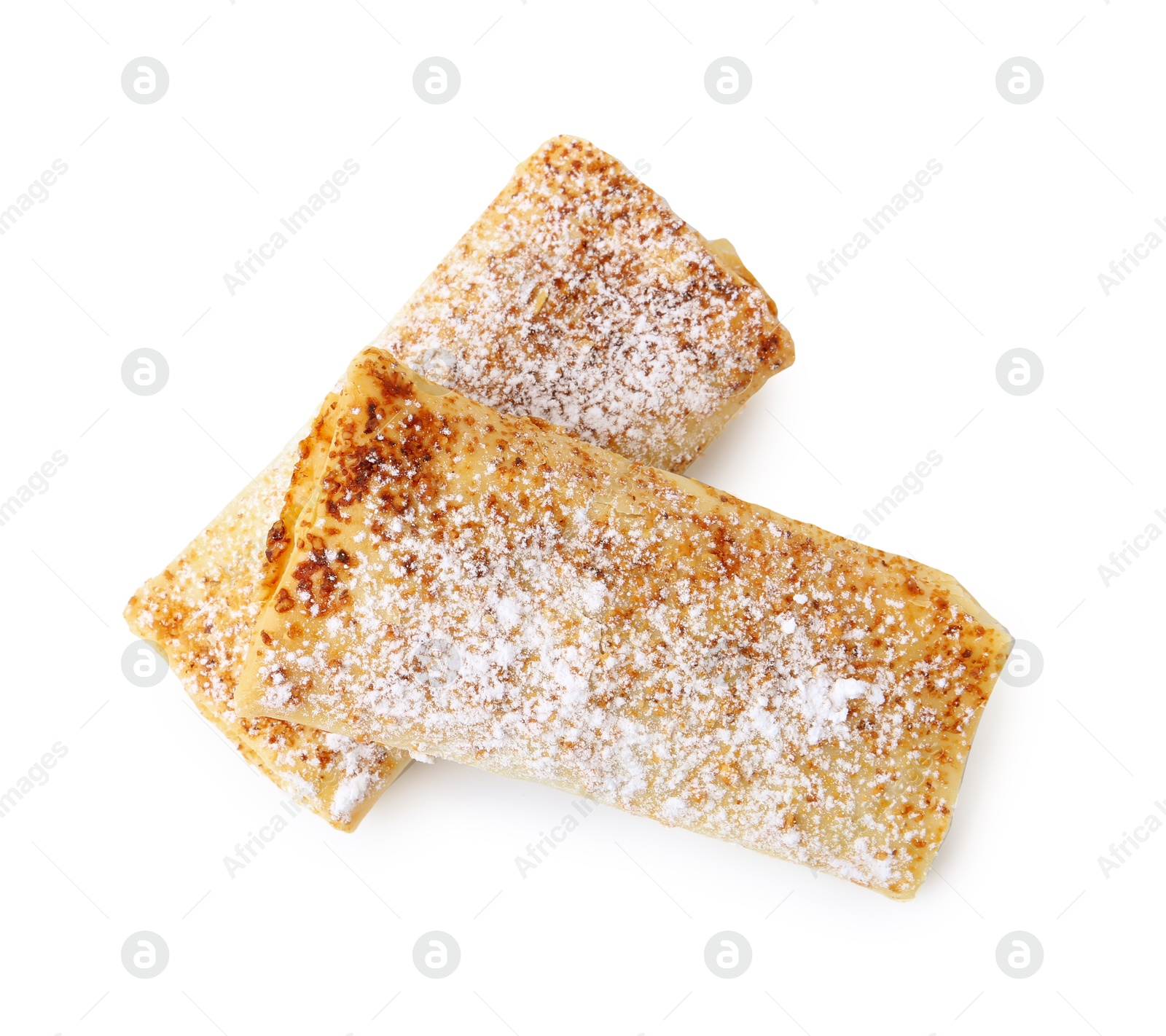 Photo of Tasty apple strudels with powdered sugar isolated on white, top view