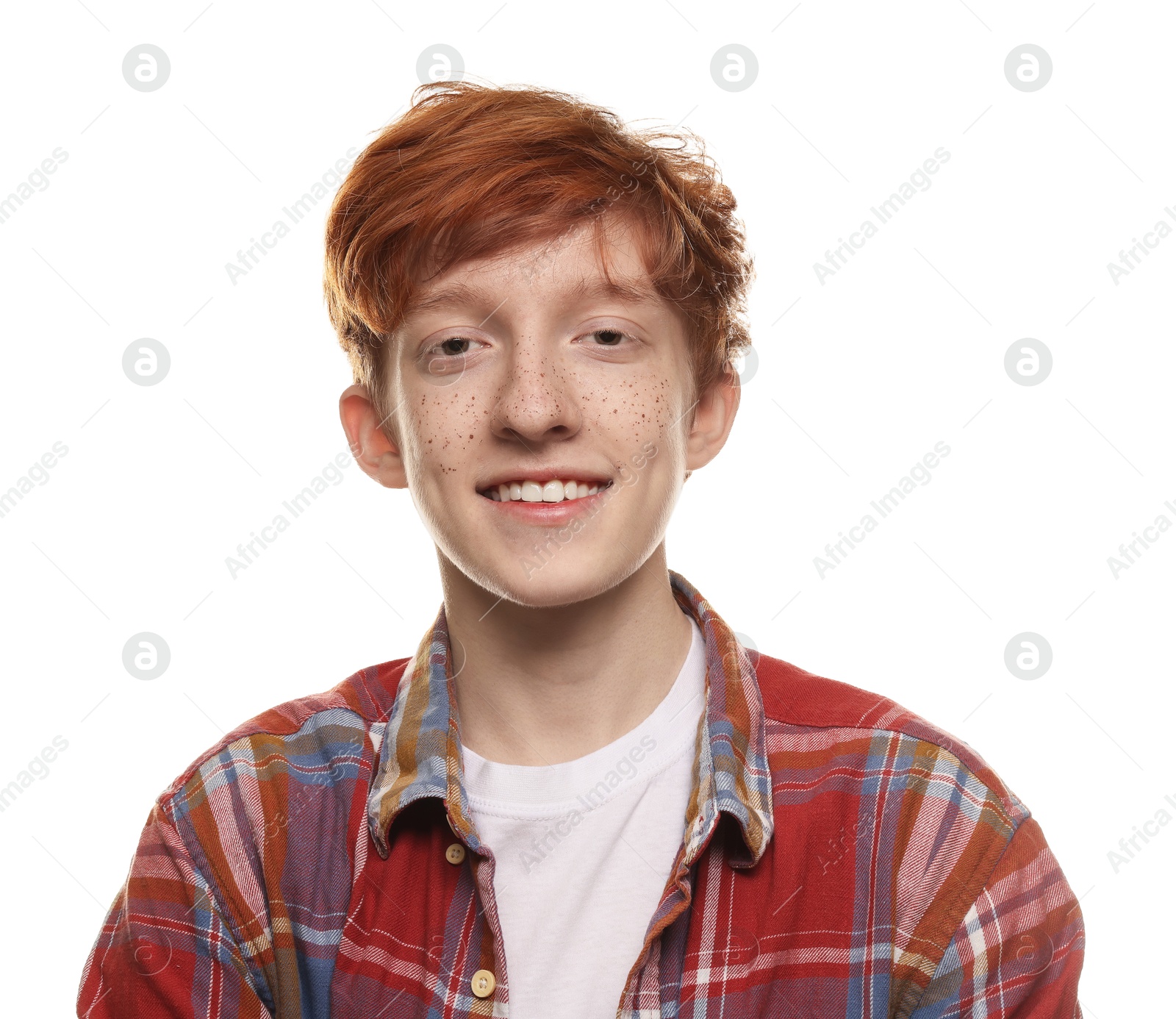 Photo of Portrait of smiling teenage boy with freckles on white background