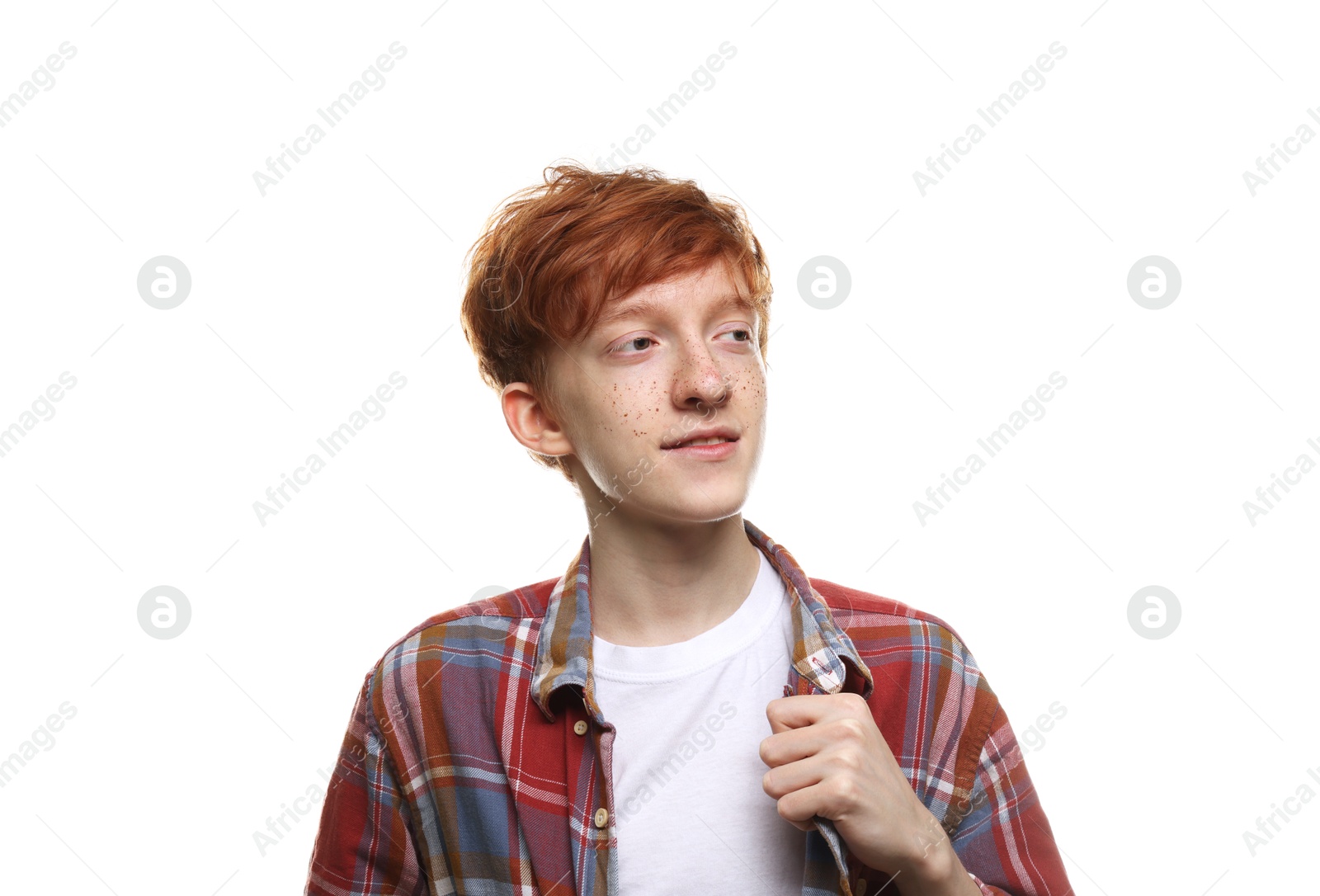 Photo of Cute teenage boy with freckles on white background