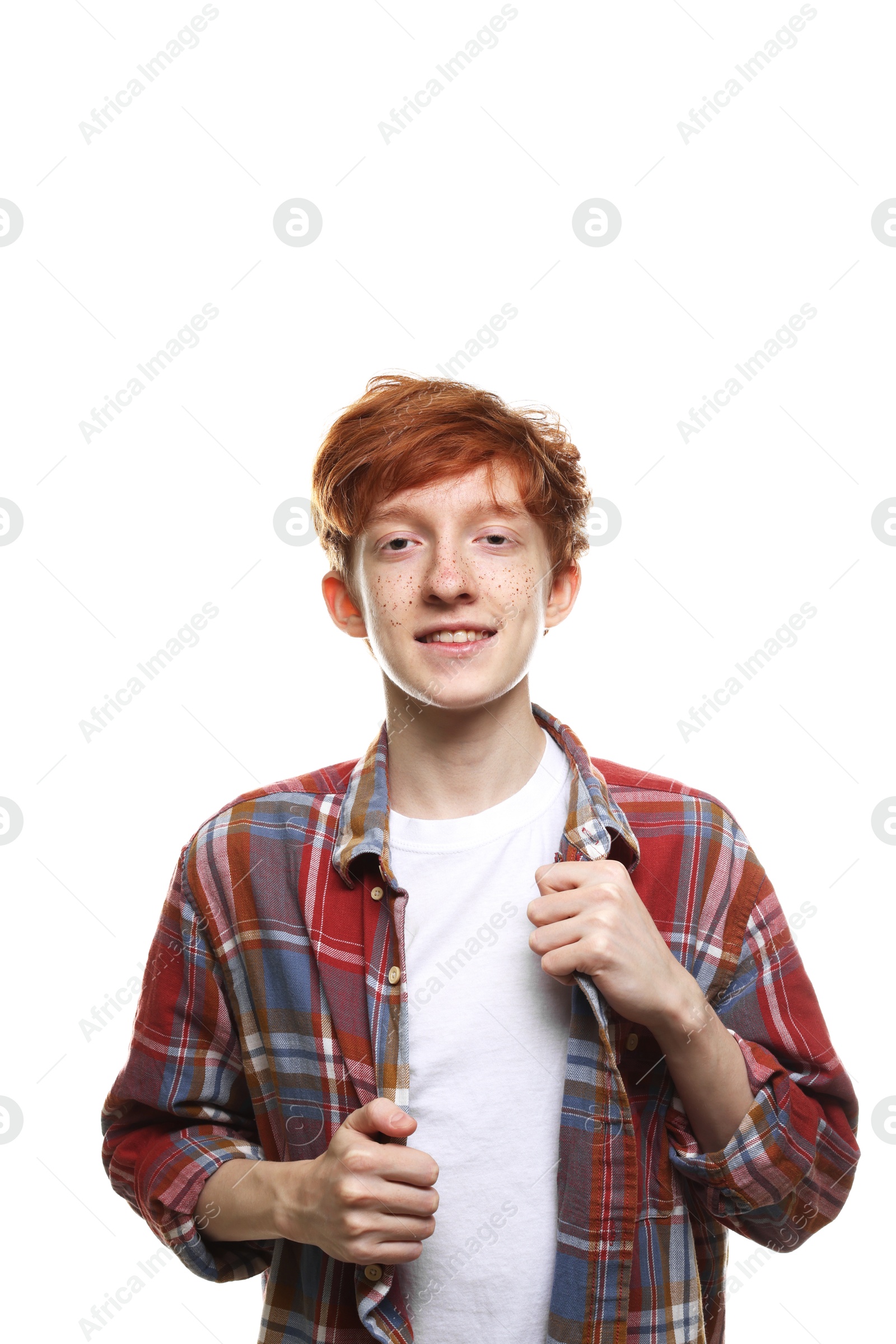 Photo of Portrait of smiling teenage boy with freckles on white background