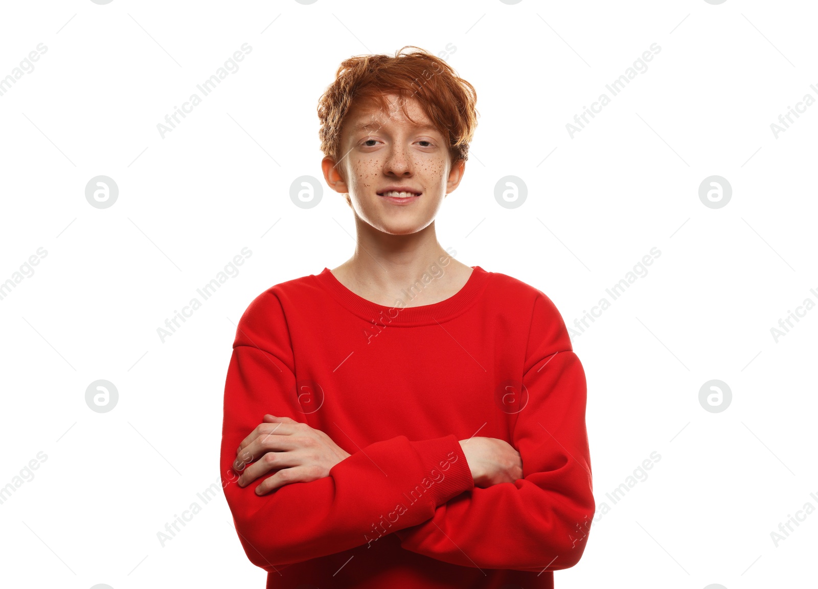 Photo of Portrait of smiling teenage boy with freckles on white background