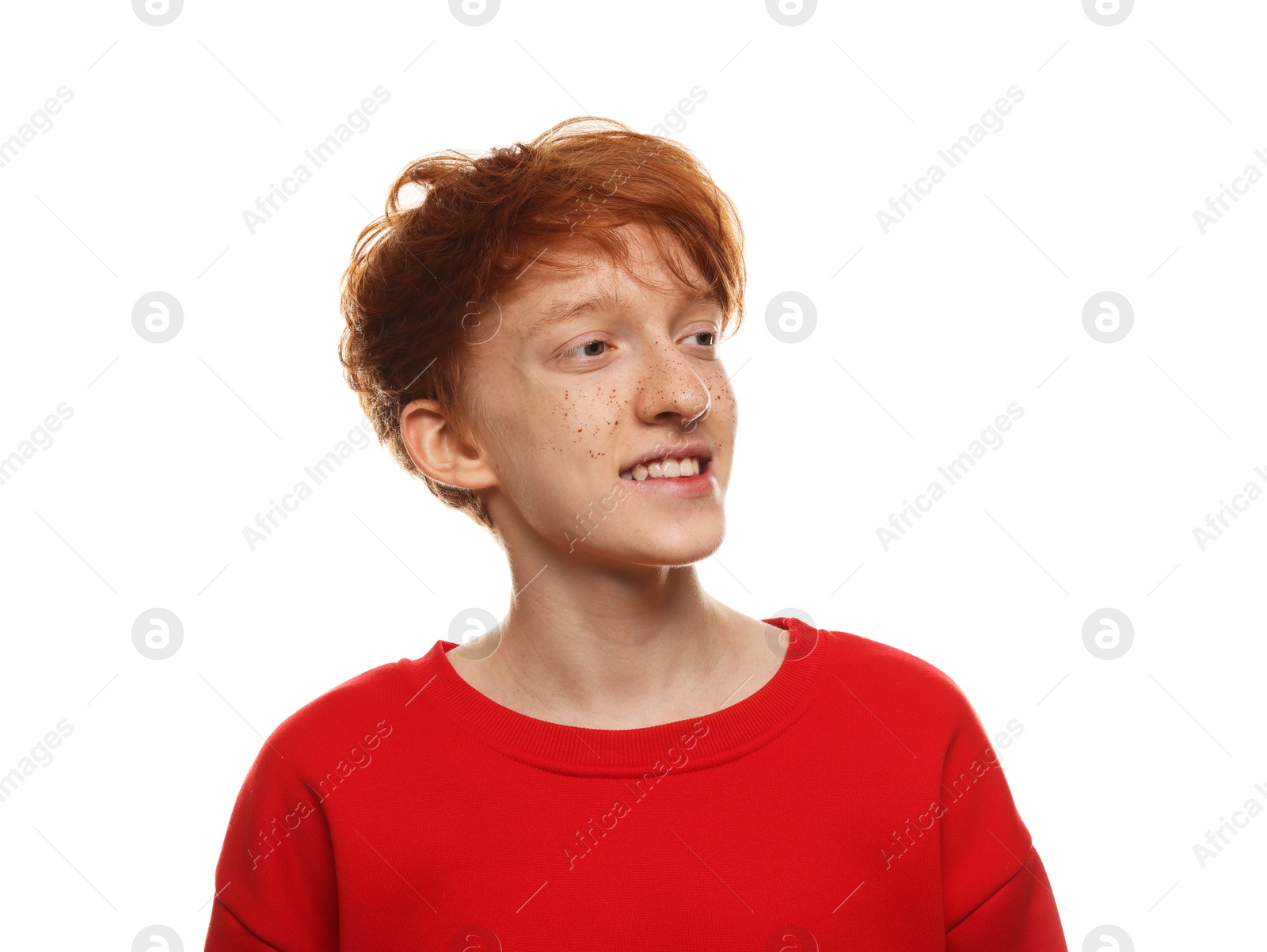 Photo of Smiling teenage boy with freckles on white background