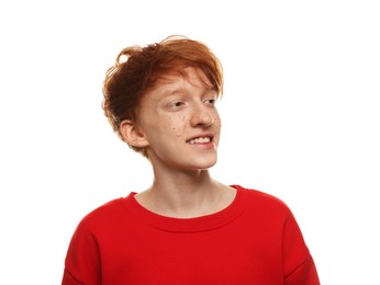 Smiling teenage boy with freckles on white background