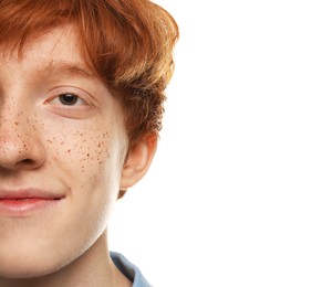 Photo of Teenage boy with freckles on white background, closeup