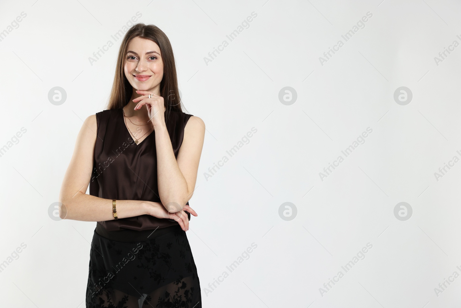 Photo of Beautiful woman in stylish outfit on white background