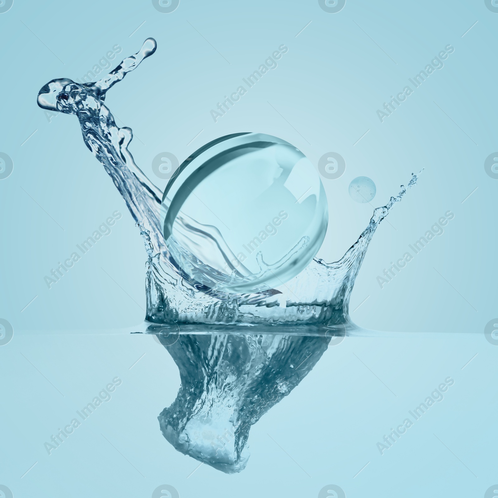 Drop of cosmetic serum and splashing water on light blue background Image of Drop of cosmetic serum and splashing water on light blue background