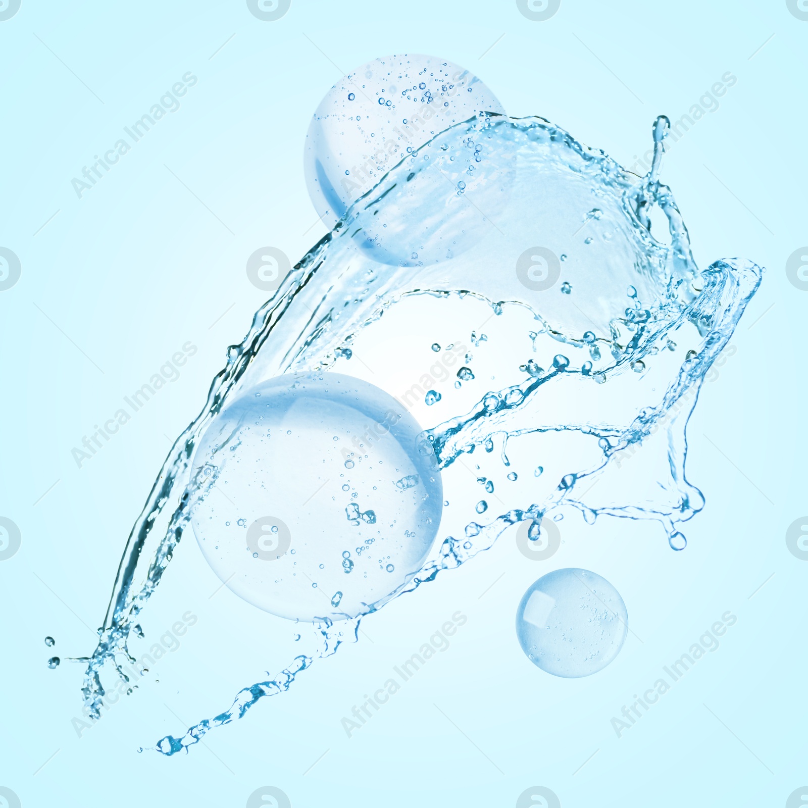 Drops of cosmetic serum and splashing water on light blue background Image of Drops of cosmetic serum and splashing water on light blue background