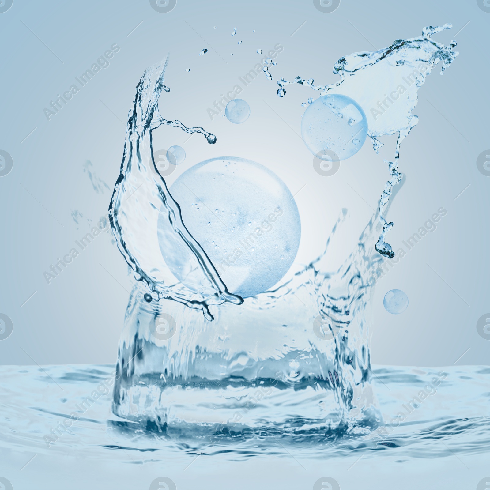 Drops of cosmetic serum and splashing water on light blue background Image of Drops of cosmetic serum and splashing water on light blue background
