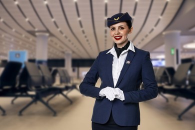 Image of Smiling stewardess in waiting area at airport. Space for text