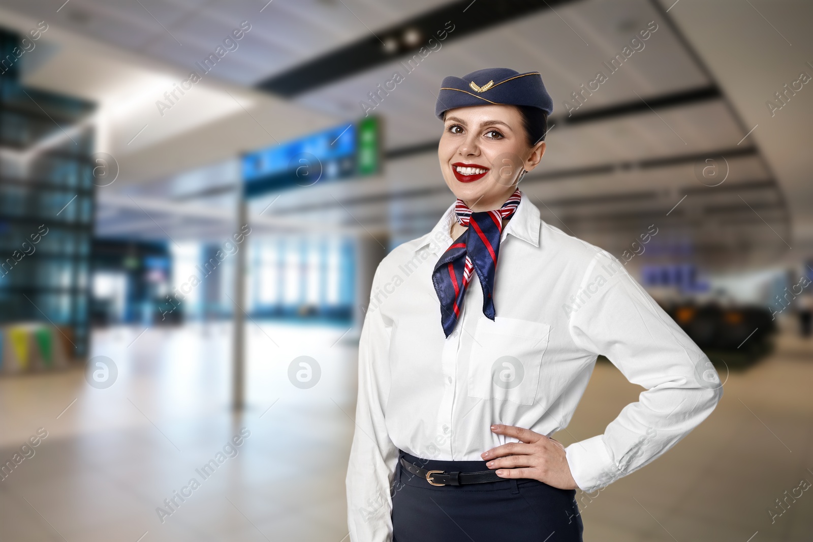 Image of Smiling stewardess in waiting area at airport. Space for text