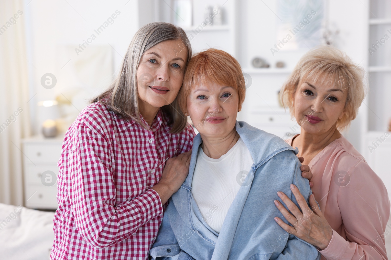 Photo of Friendship. Portrait of senior women at home