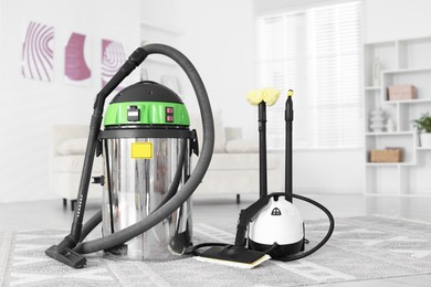 Professional hoover and vapor steam system at home. Cleaning appliances