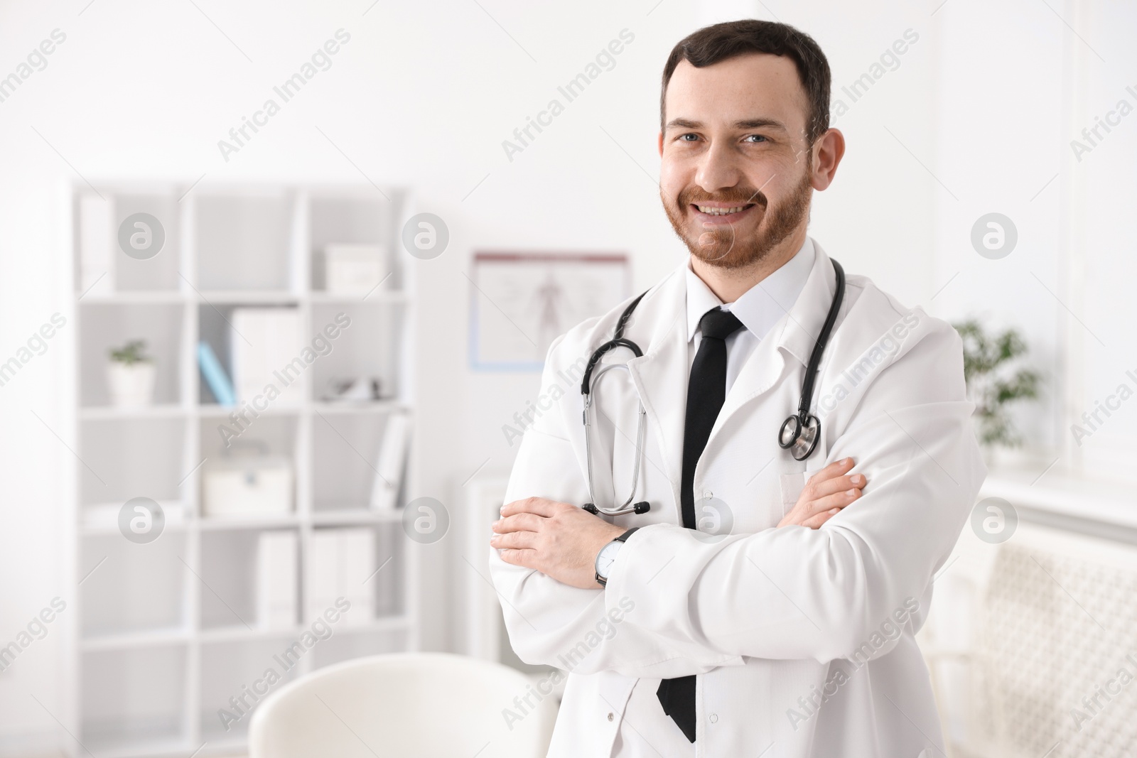 Photo of Portrait of professional doctor with stethoscope in hospital. Space for text