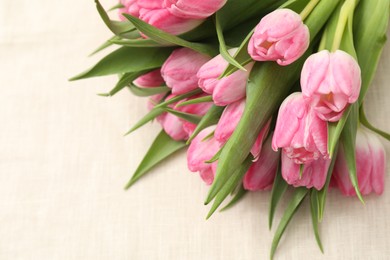 Photo of Bouquet of beautiful tulips on table, closeup. Space for text