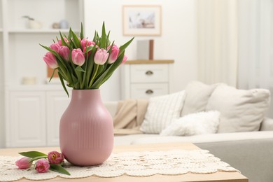 Photo of Bouquet of beautiful tulips in vase on table indoors, space for text