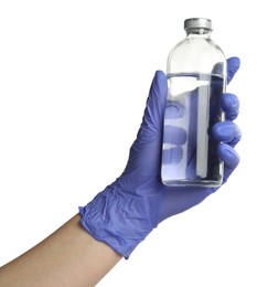 Photo of Doctor in medical glove holding bottle of medication on white background, closeup