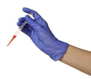 Photo of Doctor in medical glove holding pipette with blood sample on white background, closeup