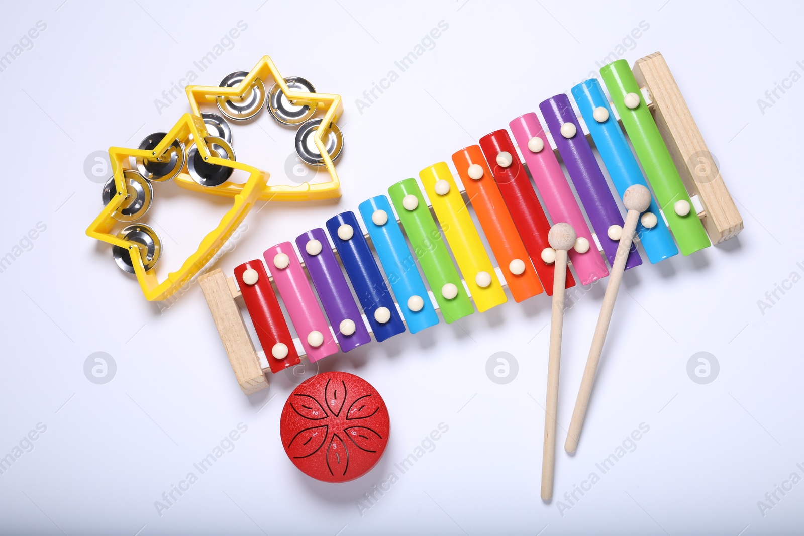 Photo of Flat lay composition with different toy musical instruments on white background