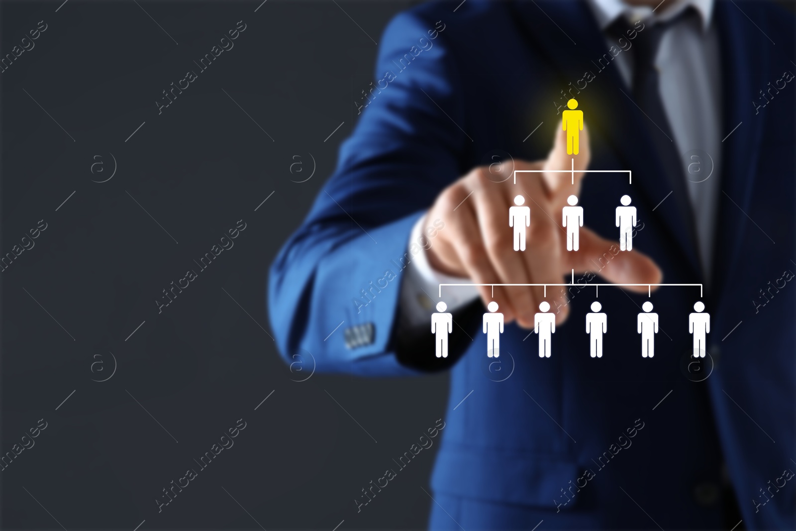 Image of Targeting, recruitment, human resources management. Businessman touching virtual screen with scheme of human icons against dark grey background, closeup