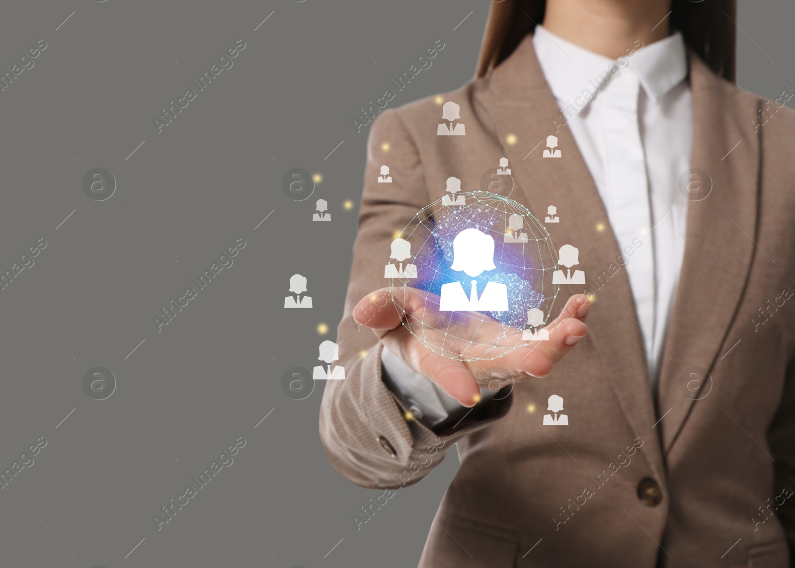 Image of Targeting, recruitment, customer acquisition. Business woman holding virtual globe with human icons against grey background, closeup