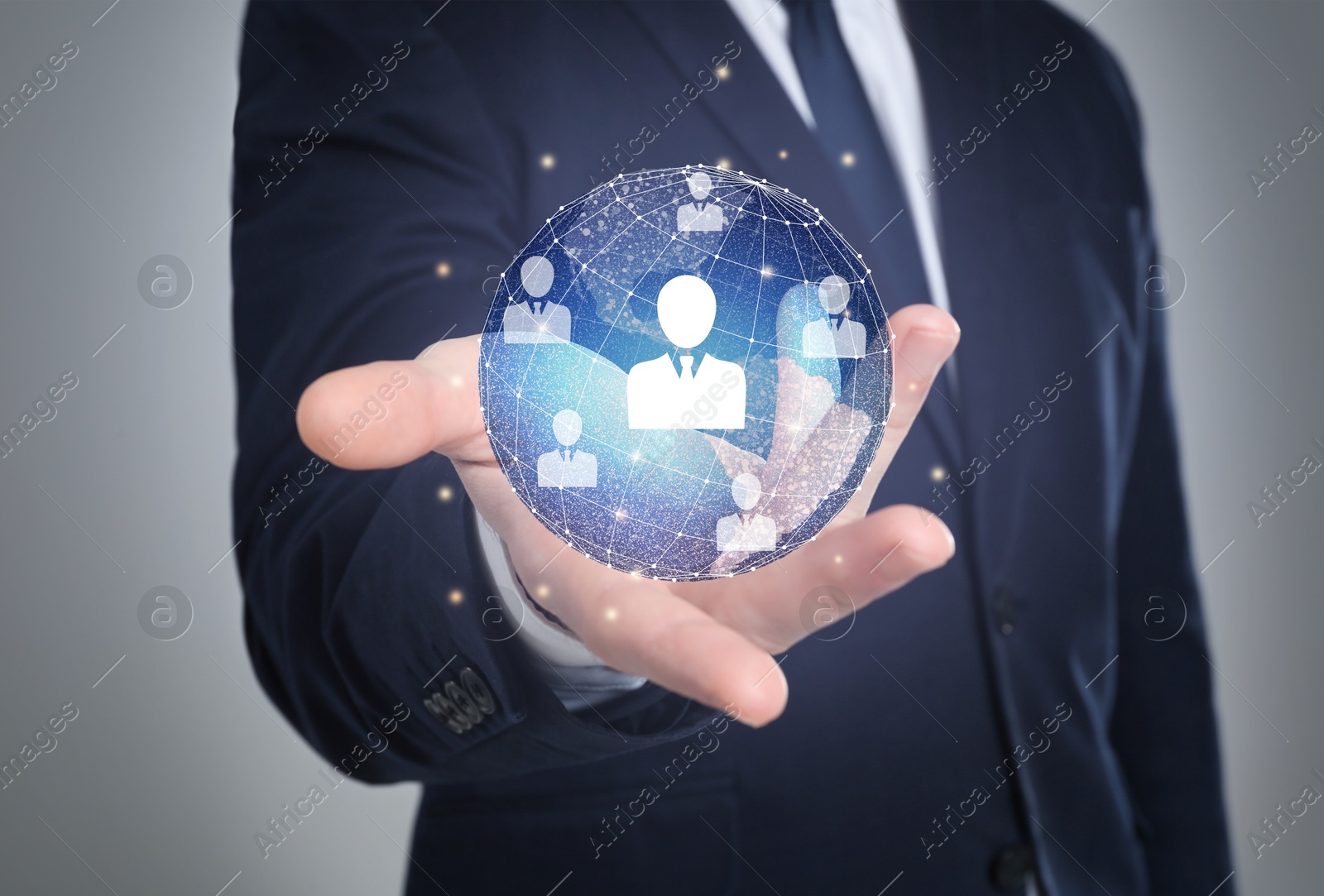 Image of Targeting, recruitment, customer acquisition. Businessman holding virtual globe with human icons against grey background, closeup