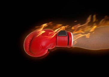 Image of Boxer with flames over his hand on black background, closeup. Stylish poster for sportive event