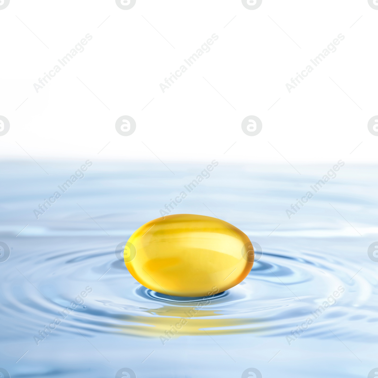 Image of Fish oil capsule in water on white background. Omega-3 fatty acids