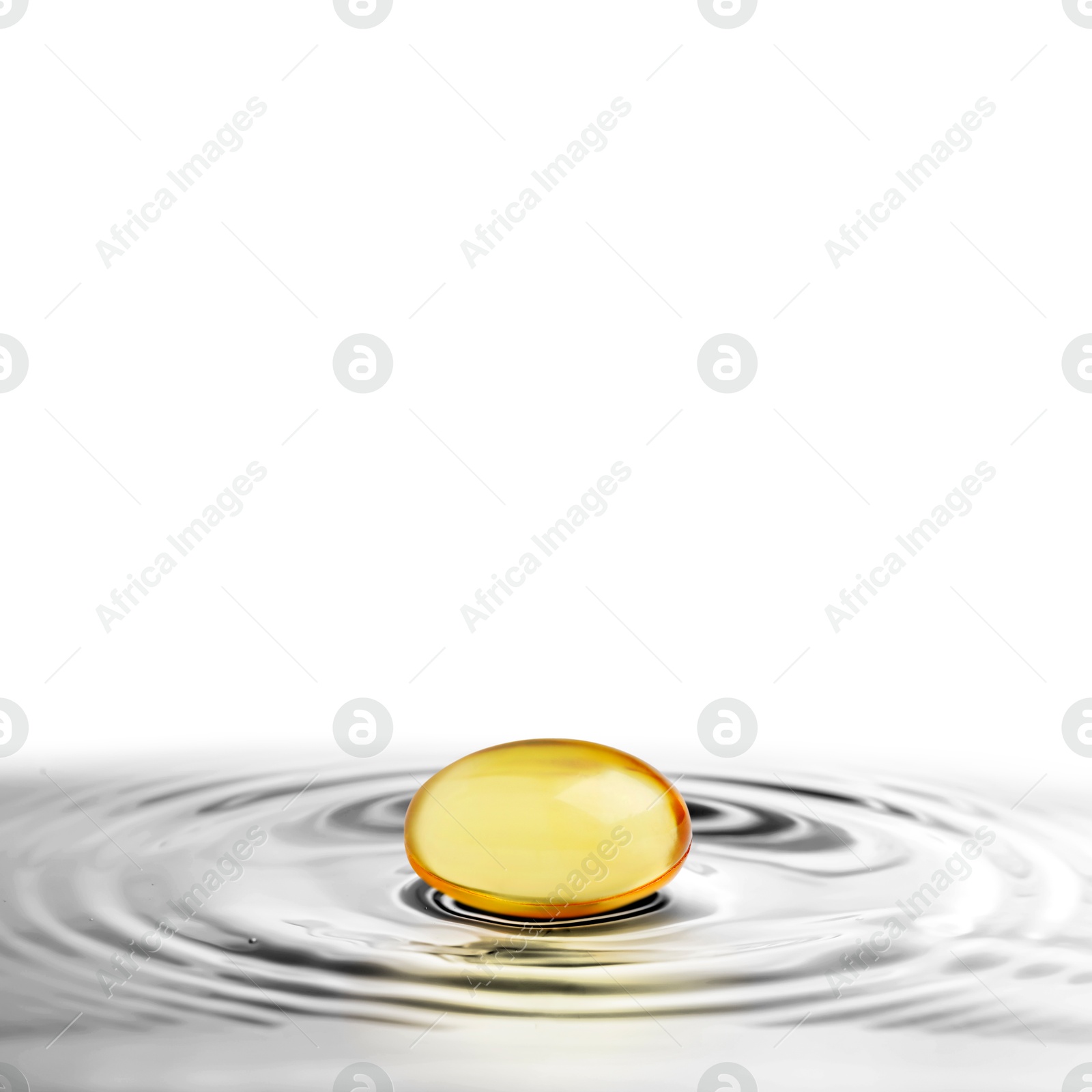 Image of Fish oil capsule in water on white background. Omega-3 fatty acids