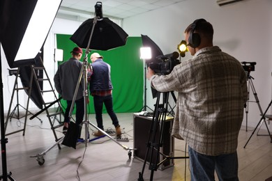 Group of people working in modern film studio