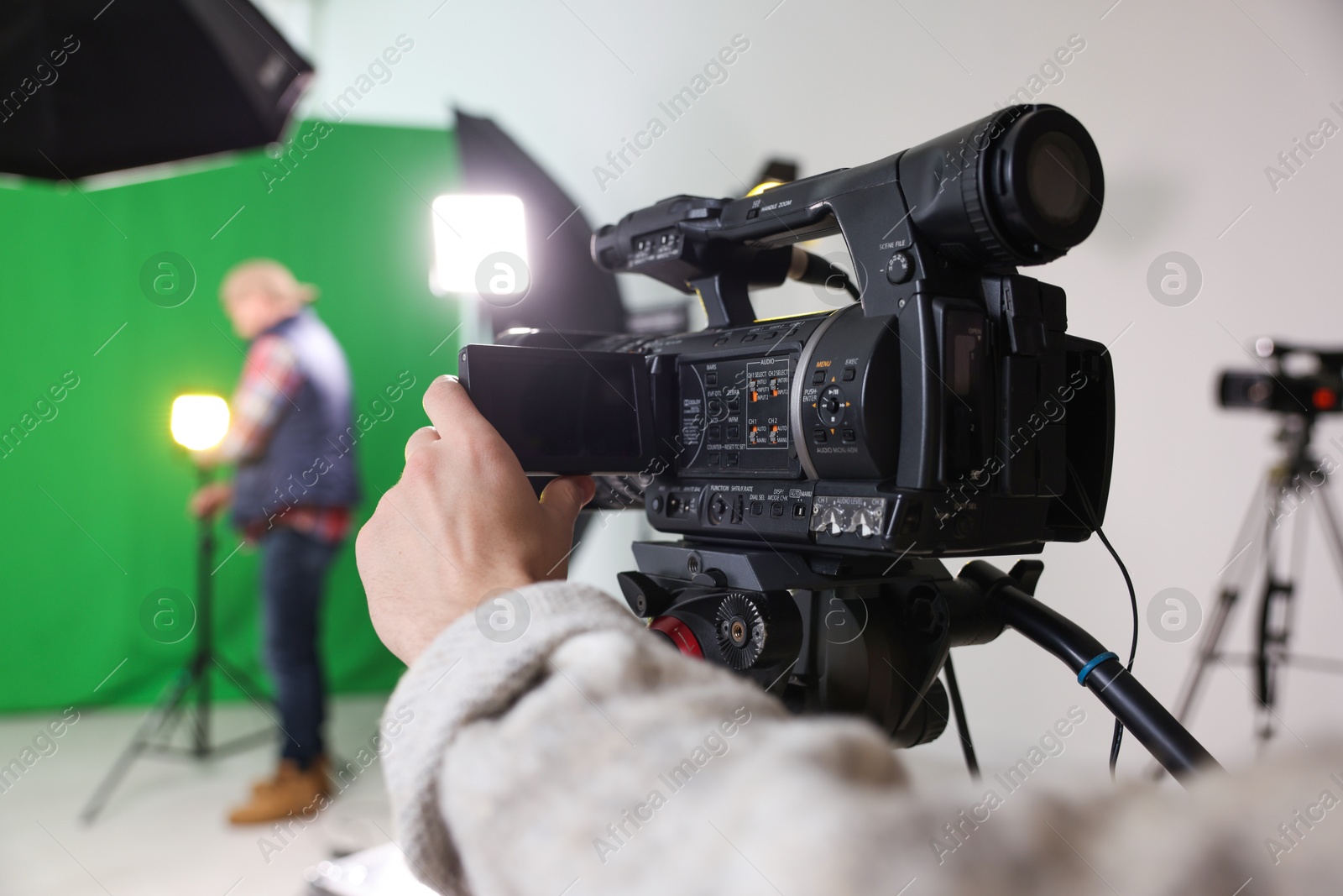 Photo of People working in modern film studio, selective focus