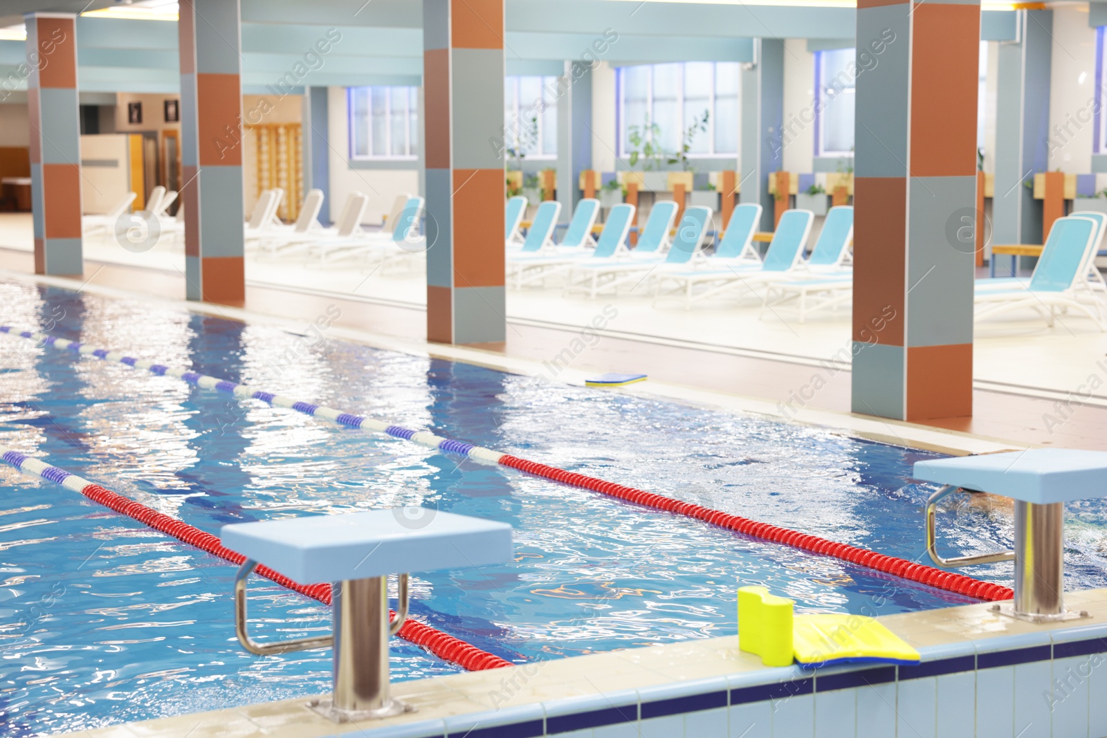 Photo of Swimming pool with clean water and lane dividers indoors