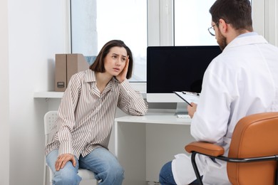 Dependent woman having appointment with addiction specialist in clinic