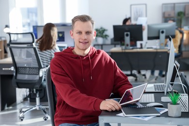 Photo of Stock exchange. Man working at desk in office