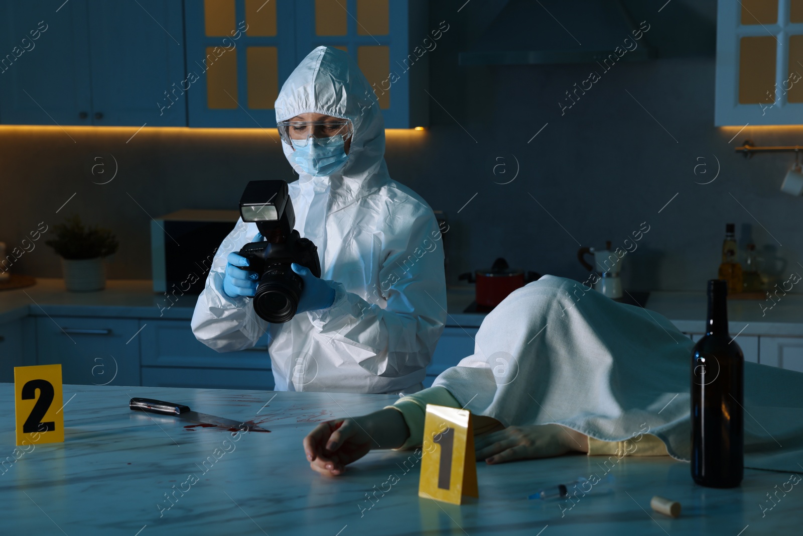 Photo of Forensic expert with camera working at crime scene and dead woman's body indoors