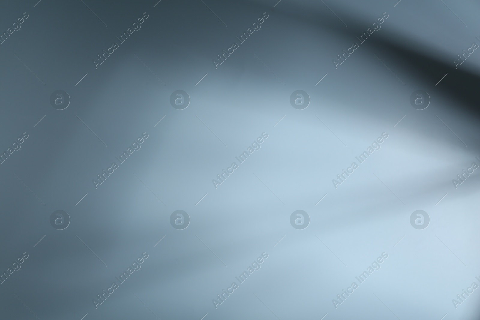 Photo of Light and shadows falling on white background