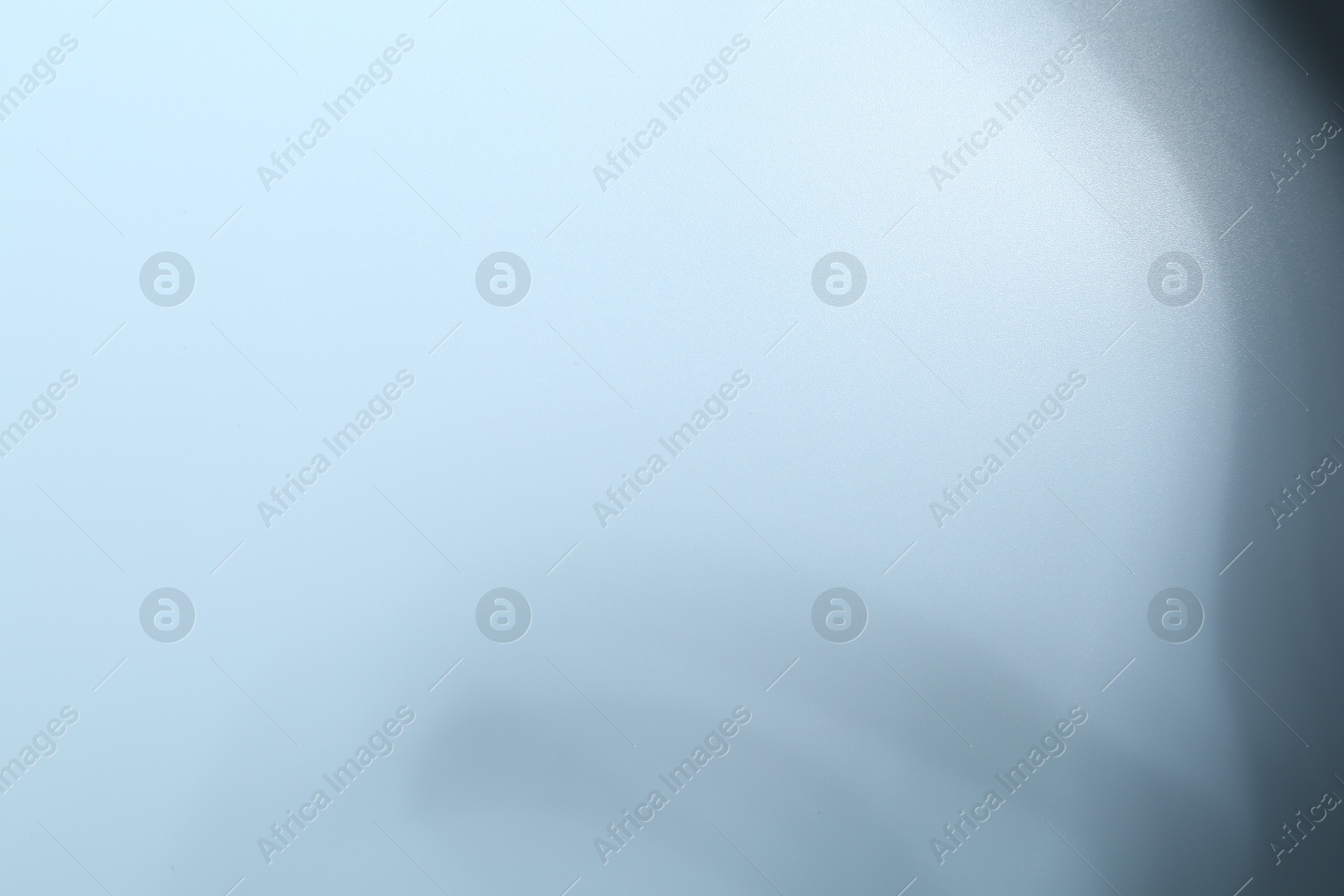 Photo of Light and shadows falling on white background