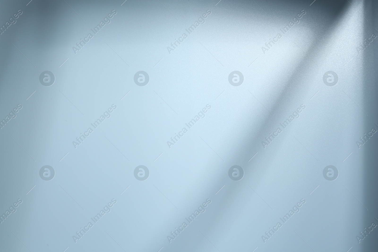 Photo of Light and shadows falling on white background