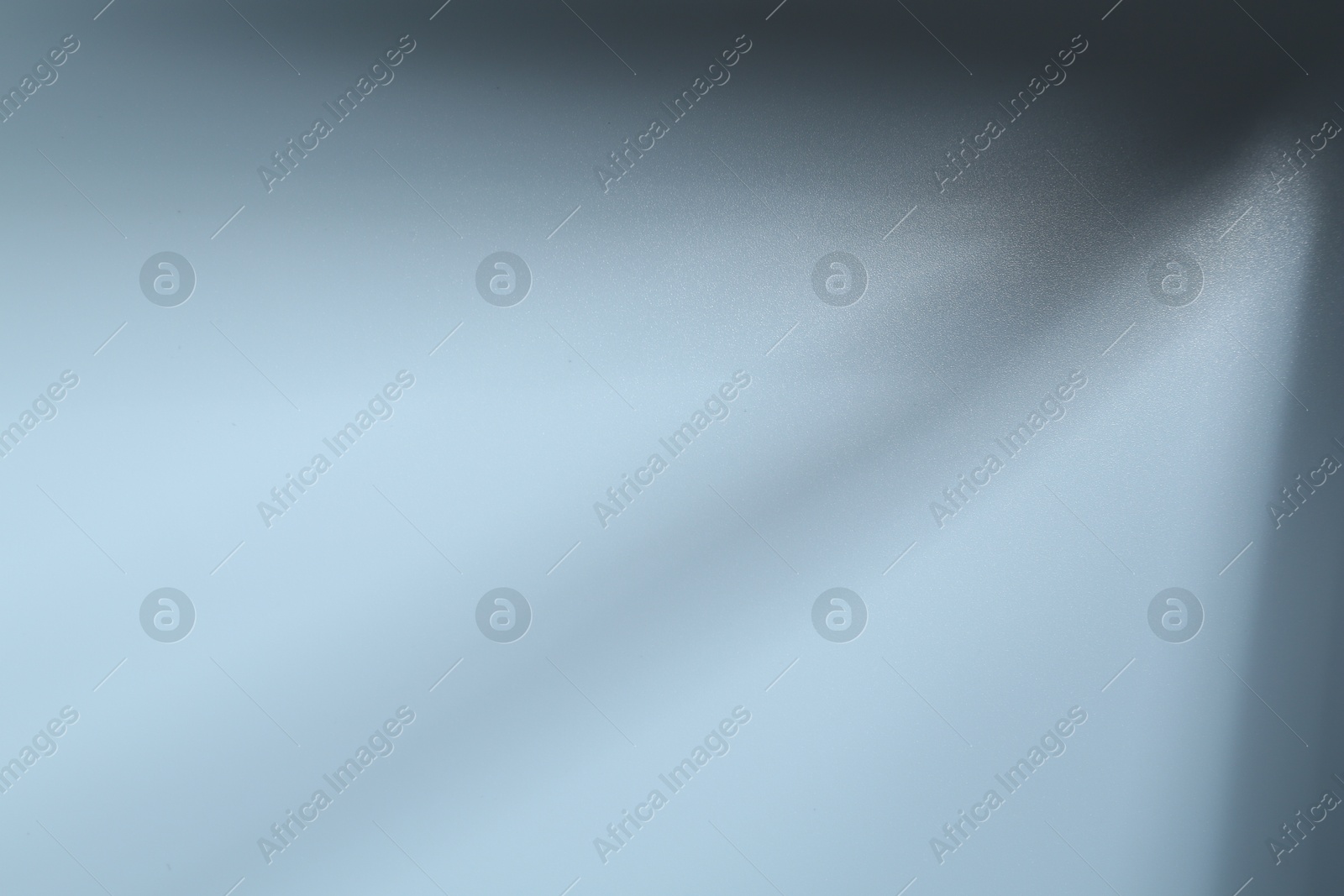 Photo of Light and shadows falling on white background