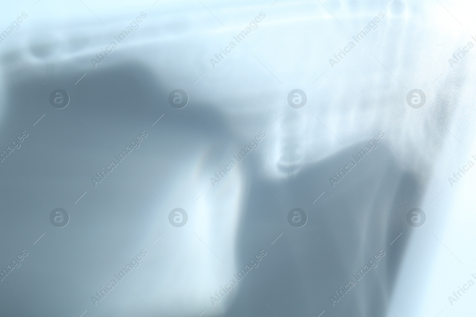 Photo of Light and shadows falling on white background