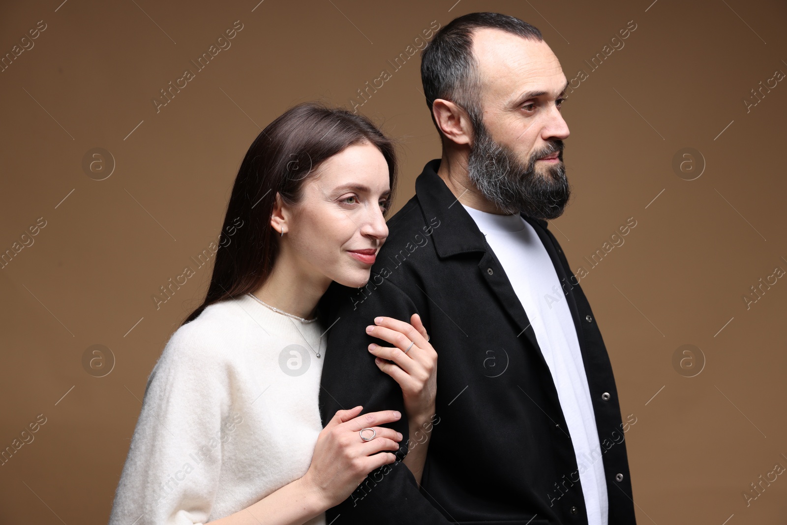 Photo of Cute daughter and father on brown background