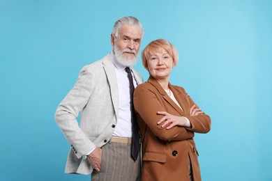 Photo of Portrait of lovely senior couple on light blue background