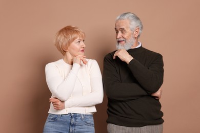 Photo of Portrait of lovely senior couple on beige background