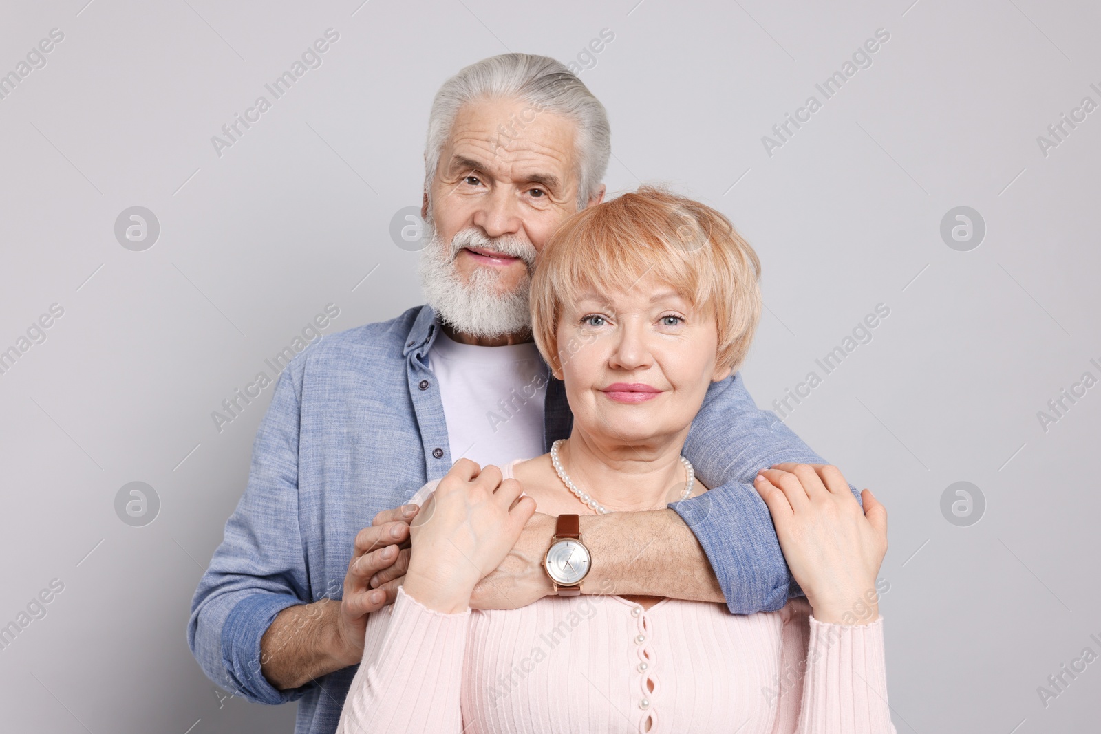 Photo of Portrait of lovely senior couple on grey background