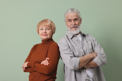 Photo of Portrait of lovely senior couple on green background