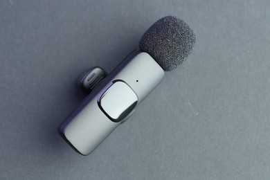 Photo of Lavalier microphone on grey background, top view