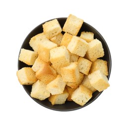 Photo of Delicious crispy croutons in bowl isolated on white, top view