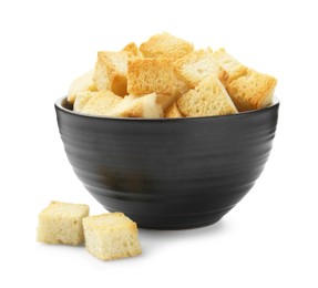 Photo of Delicious crispy croutons in bowl isolated on white