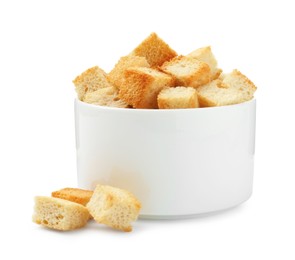 Photo of Delicious crispy croutons in bowl isolated on white